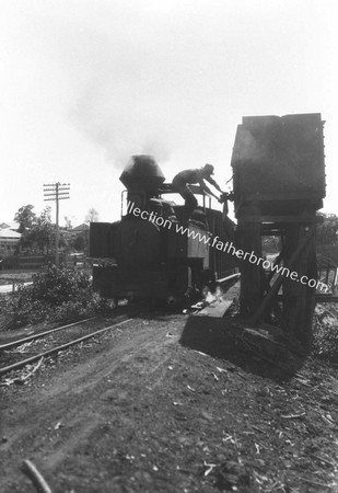 TRAINS ON WAY TO SUGAR FIELDS  TAKING WATER